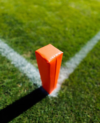 Close up view of a pylon in the end zone of a generic football stadium. Good generic college or professional football concept photo