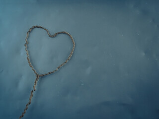 Rope heart on silver background for Valentine's Day