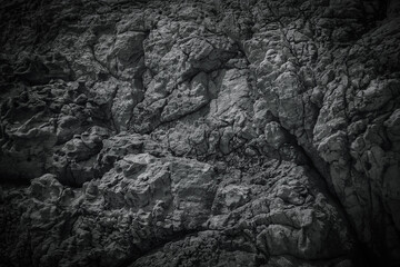 Dark black stone texture , rough patterns on grey background