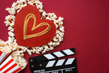 A banner for the film industry. A romantic movie date. A movie camera, 3D glasses, popcorn and a...