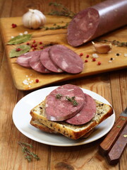 Balyk sausage on wooden background