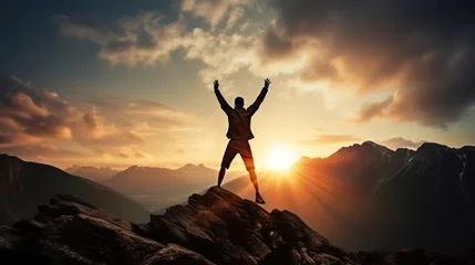 Poster Happy man raising his arms jumping to the top of the mountain, successful businessman celebrating success on the cliff, business success concept silhouette backlit. © Phoophinyo