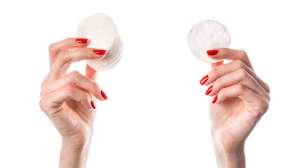 Woman holding cotton pads isolated on white background. Cotton pads in female hand with red nails.