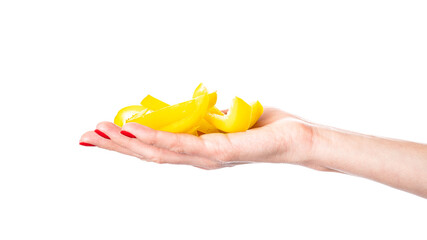 Yellow sweet bell pepper slices in hand isolated on a white background. Woman holding bulgarian...