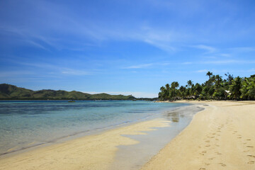 Walking along the Beautiful Beach on the Tropical Island of Fiji on a Sunny Day
