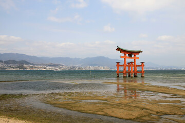 Itsukushima Floating Torii Gate in the distance on Miyajima Island, Japan