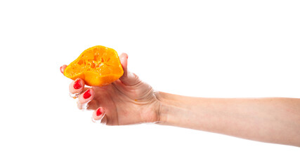 Tangerine in hand isolated on white background.