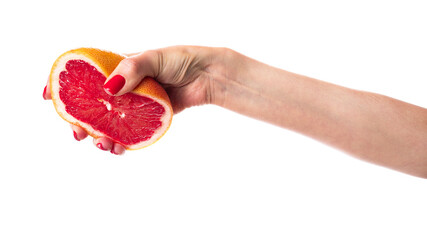 Juicy fresh grapefruit in a beautiful woman's hand isolated on white