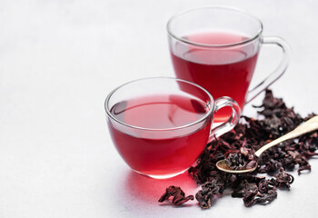 Hibiscus tea in glass mug.