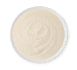 Delicious semolina pudding in bowl isolated on white, top view