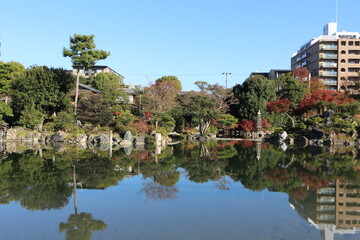 Fototapeta na wymiar Ingetsu Pond and autumn leaves in Shosei-en Garden, Kyoto, Japan