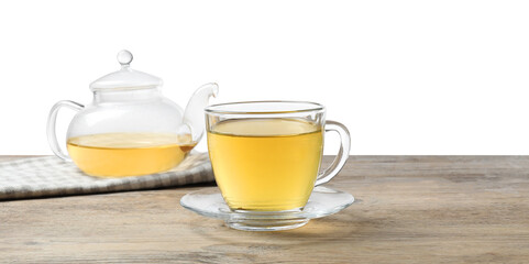Refreshing green tea in cup and teapot on wooden table against white background
