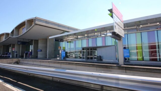 Car descends from highway to terminals of Airport.