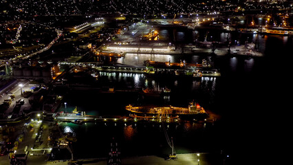 Novorossiysk, Russia. Port of Novorossiysk at night. Night city lights. Tsemesskaya Bay in the...