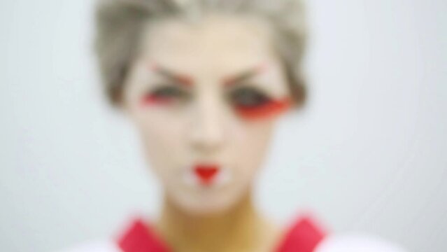 Close up of girl in kimono with make up of Japanese geisha