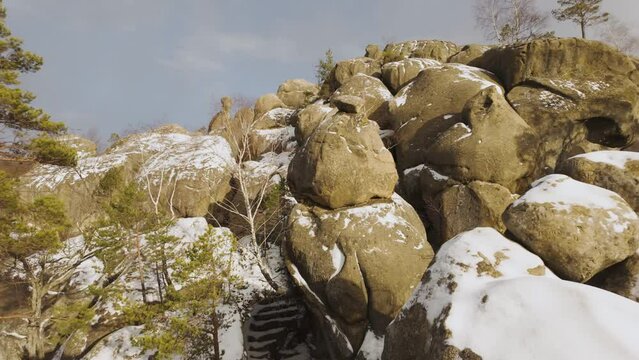 ancient cave monastery in the Carpathians in Bubnyshche, Ukraine, which is hundreds of years old, and the Dovbush rocks are millions of years old. Time lapse with clouds that symbolize transience