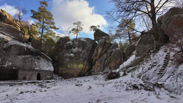 ancient cave monastery in the Carpathians in Bubnyshche, Ukraine, which is hundreds of years old, and the Dovbush rocks are millions of years old. Time lapse with clouds that symbolize transience
