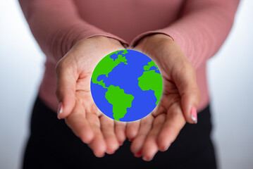 Earth day concept. Hands holding a small world. Environment concept. April 22.