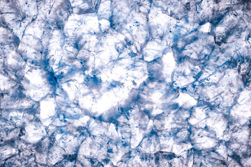 blue tainted quartz in agate macro photography detail texture. close-up polished semi-precious...