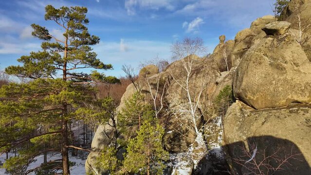 ancient cave monastery in the Carpathians in Bubnyshche, Ukraine, which is hundreds of years old, and the Dovbush rocks are millions of years old. Time lapse with clouds that symbolize transience