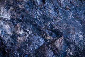 blue covellite (covelline) from kennecott, alaska. macro photography detail texture background. close-up raw rough unpolished semi-precious gemstone
