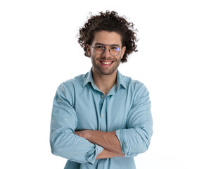 young casual man standing with arms crossed