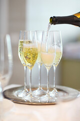 Champagne glasses and bottle in restaurant