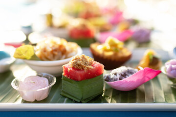 A variety of traditional Thai desserts and snacks serving on banana leaf. Royal Thai cuisine.