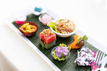 A variety of traditional Thai desserts and snacks serving on banana leaf. Royal Thai cuisine.