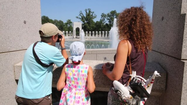Mother with children in National Mall - complex of monuments and museums