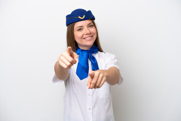 Airplane Lithuanian woman stewardess isolated on white background points finger at you while smiling