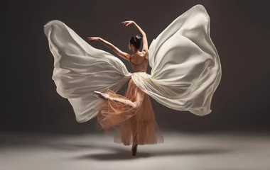 Cercles muraux École de danse Ballerina. Young graceful woman ballet dancer, dressed in professional outfit, shoes and beige weightless skirt is demonstrating dancing skill. Beauty of classic ballet.