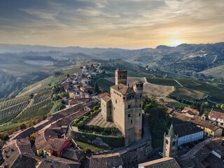 the castle of serralunga d'alba taken from a drone with a view from above during a spectacular...