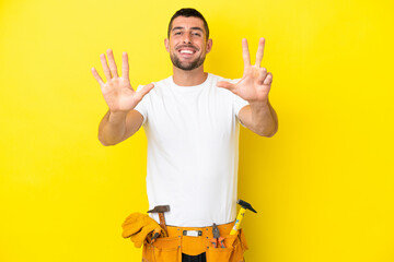 young electrician caucasian man isolated on yellow background counting eight with fingers