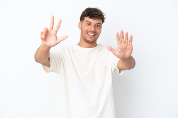 Young caucasian handsome man isolated on white background counting eight with fingers