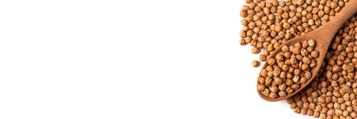 Dry organic chickpeas in a wooden spoon isolated on white background with copy space. Banner. Top view. 