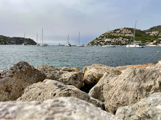 View of Port Andratx on the Spanish holiday island of Mallorca with the book and the sea as well as many sailing boats