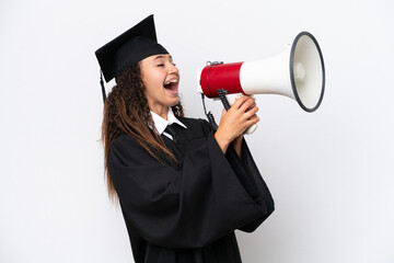 Young university graduate Arab woman isolated on white background shouting through a megaphone