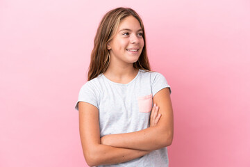 Little caucasian girl isolated on pink background happy and smiling