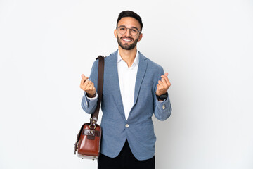 Young caucasian business man isolated on white background making money gesture