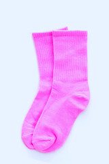 Pink socks on white background.