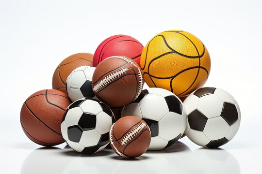 Diverse collection of sports balls, including basketballs, soccer balls, and footballs, piled together against a white background, symbolizing team sports and athleticism.
