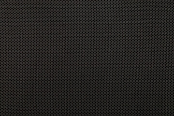 Black surface background. Textile texture knitted black threads. Speaker cover material.