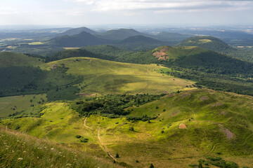 Auvergne vulcan since top of the Puy de Dome vulcan at sunset. Dramatic light landscape. Clermont...