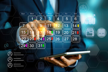 Reminder appointment calendar for organizer agenda time table and event planner organize and schedule activity. Man pointing on calendar or schedule to marking color paper note target date appointing.