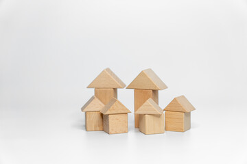 building wood blocks on white background; business or creative concept