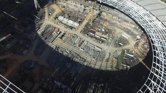 Roof above building site of sports stadium Luzhniki at summer
