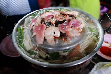 Thai buffet with pork, chicken and other meats, cooked on brass barbecue pan