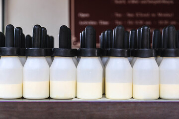 Milk bottles for feeding calves Made of plastic with rubber stopper. © unairakstudio