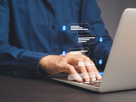 Businesswoman typing on a laptop with live chat on application communication.